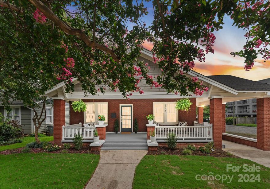 Own a piece of history in iconic Plaza Midwood and its most beloved street, Thomas Avenue! Literally a few steps from the center of Plaza Midwood's restaurants, shops and culture. This 1920 classic brick bungalow has been completely refurbished and ready to move in. This 3 bedroom, 3.5 bath home features brand new framing, new roof, new heating and cooling, new water heater, new electrical, new plumbing, new insulation and professionally restored windows. Designer finishes include engineered oak hardwoods, quartz counters and custom cabinetry throughout, sophisticated lighting and plumbing fixtures. Cozy living room features a gorgeous marble fireplace mantle. Gourmet kitchen features top of the line equipment and appliances. Thoughtfully designed drop zone. Primary bedroom suite has luxury bath and walk in closet. Flat, fully fenced back yard with new sod. Entertain on your front oversized front porch. Truly the definitions of historic charm, location and luxury living combined.
