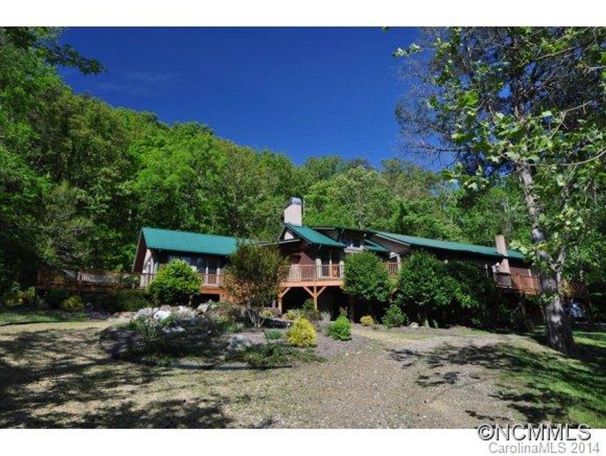 Craftsman built Arts and Crafts home on the French Broad River just outside the town of Hot Springs. Easy river access for kayaking & tubing, adjoining National Forest for privacy. Beautiful pastures for your horses or livestock. 4 BR 2.5 BA, fireplace, open floor plan. spacious master suite with whirlpool tub, Jotel wood stove in kitchen. Great room. screen porch, decks, patio and courtyard. Incredible well water. Tranquil setting.