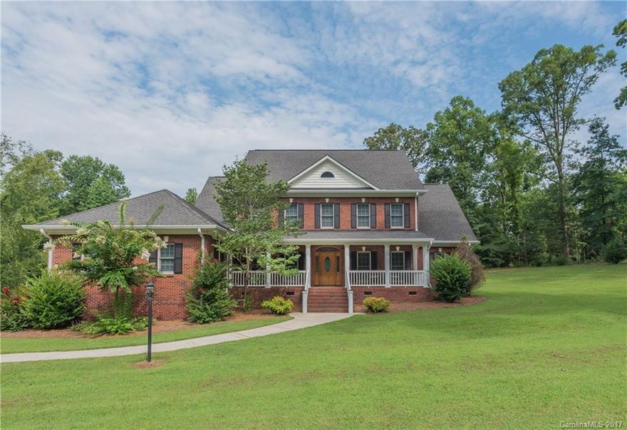 Welcome to 2323 One Iron Dr. York, SC. Just Outside the City Limits & Perched on 2+ Acres w/Private Wooded Backyard, this 2 Story, Full Brick, Well Maintained Home w/Rocking Chair Front Porch, offers a Huge Shop w/Water & Elec, Lean-to for RV storage, & Patio for Outdoor Entertaining. With Gleaming Hardwoods & Master on Main, this Beauty Has a Family Room Upstairs & Down, Formal LR & DR, & Huge Eat-in Kitchen. Convenient to the By-Pass & Springlake Country Club.  No Annual HOA!