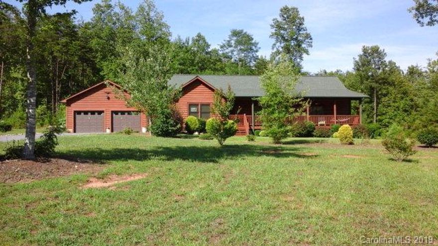 Beautiful 3/2/2 log home ranch style built in 2006. Home features a 40 foot covered front porch, large rooms and an open floor plan. Red Oak hardwood floors in the living room, dining room and three bedrooms, tile in kitchen, laundry and both baths.  Seven Ceiling fans, Gas slate fireplace with fan, Kitchen features all appliances, pine cabinets, high hat lights above the sink, moveable Island opens to dining area. Separate laundry room with built-in closets, Master bedroom features a large walk-in closet with custom shelving, master bath nice size, lots of windows in this home, rear patio, Huge 30x42 separate two car garage with storage area. Paved driveway and cement walkways. If you don't want stairs this is a great home. Property is in Hidden Lake, community pool, walk trails parks fishing.. Price Reduced... Bring me an offer!