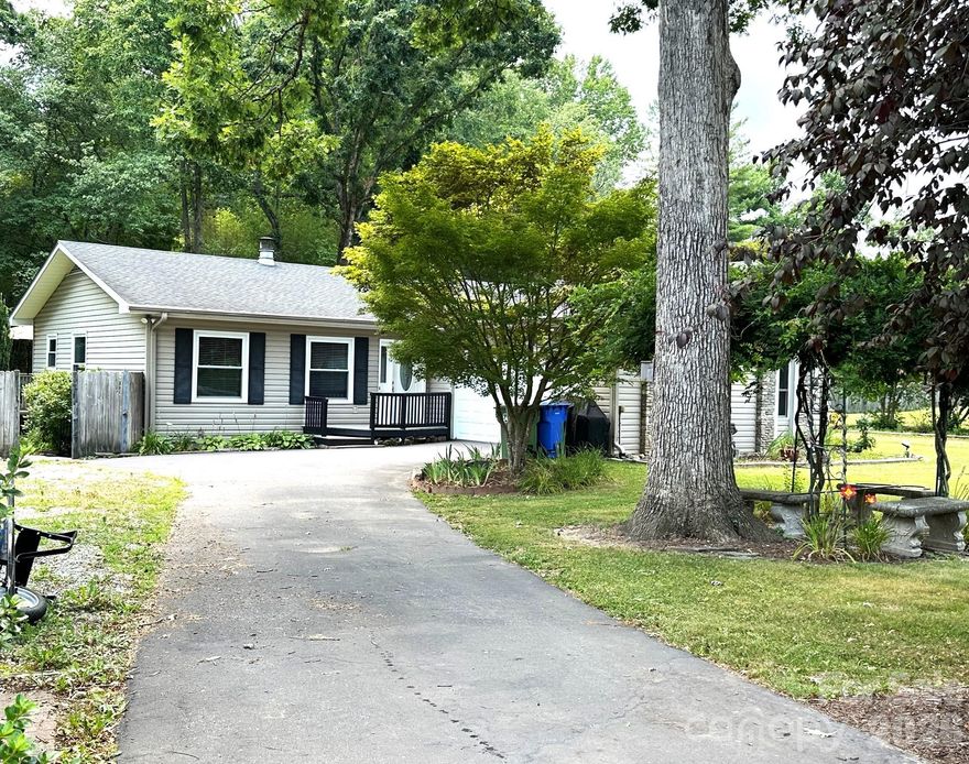 MOTIVATED SELLER!  With an acceptable offer, seller agrees to give a $10,000 credit to buyer at closing for interest rate buy down, closing costs or home improvements.  Lovely, well maintained one level ranch style home.  Situated on a picturesque .47 acre level lot. The floor plan offers 3 bedrooms and 2 full bathrooms.  Lovely hardwood floors throughout the main house.  Den was added onto the house and it has laminated flooring.  Conveniently located to shopping, entertainment, churches and schools.  Centrally located to many points of interest in Western North Carolina.  Many nice updates include granite countertops, stainless appliances, and a spacious pantry in the kitchen.  Large laundry room with lots of storage space.  Outbuilding conveys.  Older established neighborhood with well-maintained homes.  Schedule your showing today!