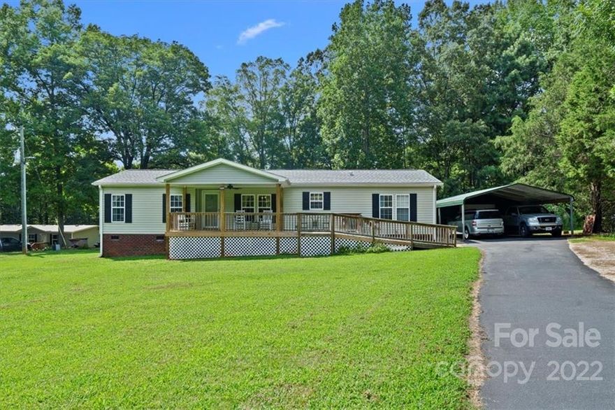 Beautiful home that won't be available long! Kitchen island with electrical outlet, convection oven with smooth top range. Huge master bathroom with dual vanity, walk-thru closet, separate garden tub with jets and shower. Energy efficient home with wood burning fireplace and new architectural shingle roof. One and a half acres with covered front & back porches, and deck. 2 car carport. Completely handicap accessible. 2 raised beds with garden and fruit trees. Too many amenities to list, schedule time now to see.