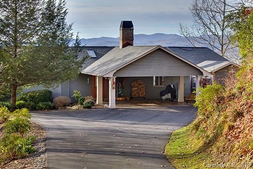 A beautiful home with a unique combination of a breath-taking view, location & quality construction. The home offers an 180-degree unencumbered mountain & valley views.The home is located only 15 mins from Brevard & 10 mins from DuPont State Forest. The home offers an open living space, stone fireplace, cathedral ceilings, & gorgeous wood floors.  LL has a den & private bedrooms. Porch & deck are perfect for enjoying the view and listening to your waterfall that is just yards from the home.