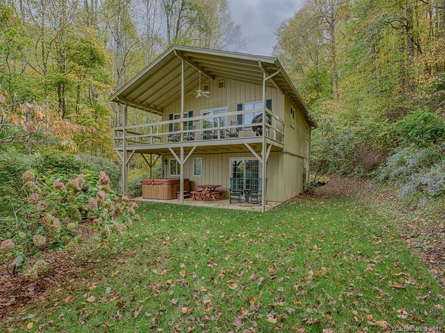 Looking for a home with a view and creek?  Look no further!  This enchanting home has both!  Perfect for seasonal getaway or full time home only minutes from downtown Waynesville.  Prepare to get comfortable here with two bedroom, two bath, den, over sized one car garage, wood burning fireplace, and level yard.  This home will be hard to resist!