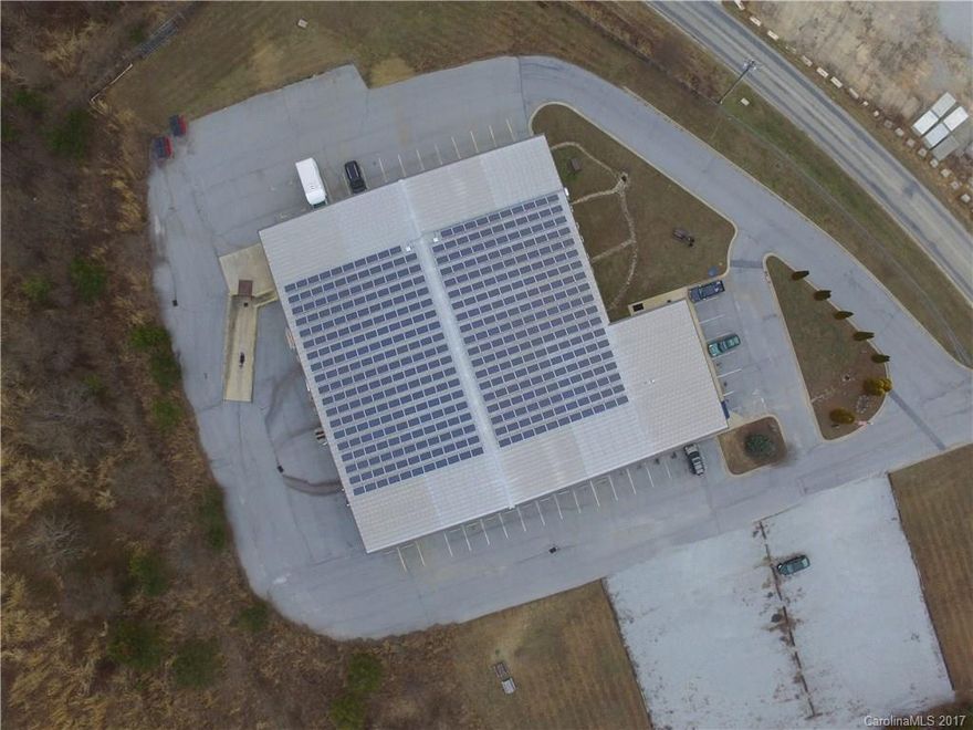 22,000 square foot industrial/light manufacturing building built in 2003. 8200 sq ft of office/phone room and 13,800 SF Warehouse on 2.75 acres. Warehouse ceiling heights 18.5 to 23' clear ceiling height. Office space has 9 ft ceiling heights but can be repurposed as warehouse space if needed to recover 8200 ft. Loading dock and 3 Roll up/drive in doors. 3 ton crane installed in warehouse. Solar power in place (See Aerials)