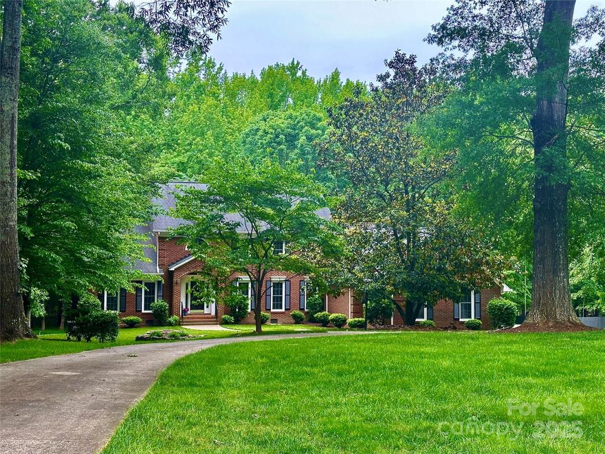 Meticulously maintained, 1 owner home nestled beautifully on 2-acres w/exceptional curb appeal & circular drive. Desirable Matthews w/exceptional Weddington schools, An elegant foyer leads to a bright, open floor plan featuring multiple living spaces incl: a spacious office or living area, cheerful sunroom, & large family room w/built-ins & cozy fireplace. Gourmet kitchen is great for entertaining w/bar seating, breakfast area opens seamlessly to family room & serene porch that overlooks peaceful surroundings. Main-level primary is a retreat, w/2 custom closets, large bath w/dual vanity & oversized glass shower. Upstairs, 3 generously sized bedrms—2 ensuite baths—versatile loft space, & bonus rm w/convenient walk-in storage. Walk-out daylight basement offers endless possibilities  & has access to a covered patio & a manicured flat yard w/ putting green. Don't miss the oversized 3-car garage!. This a rare opportunity to own a private estate w/privacy, space, & functionality—A True Gem!
