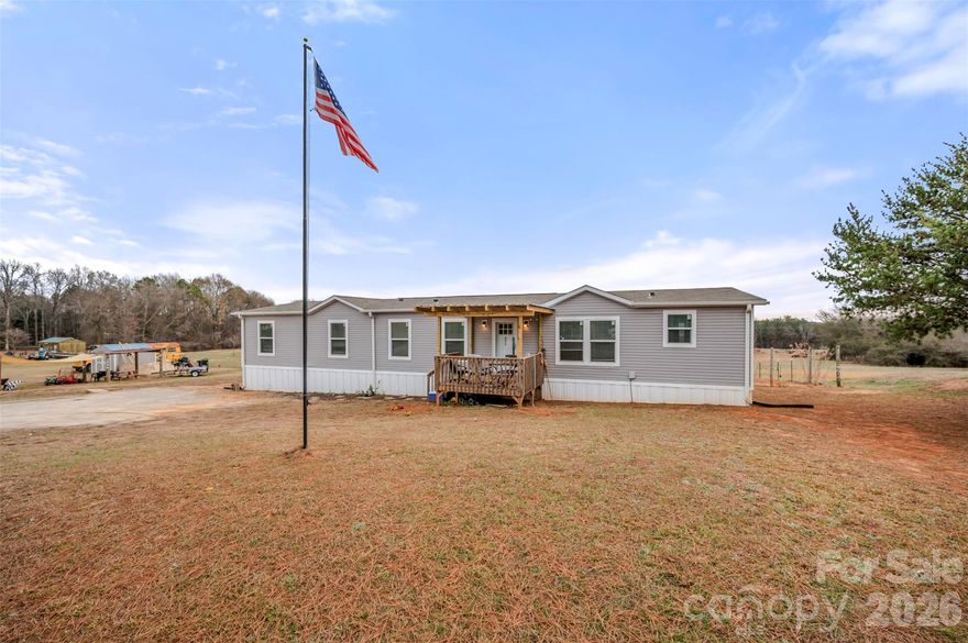 Enjoy space, privacy, and convenience in this expansive 4-bedroom, 2-bath home situated on over 1. Designed with a split floor plan, the private primary ensuite is thoughtfully separated from the additional bedrooms.The primary suite features a large walk-in closet and a spacious bathroom with double vanities, a soaking tub, and a generously sized walk-in shower. The additional bedrooms are well-sized and include walk-in closets for ample storage. A versatile den with a closet offers endless possibilities—perfect for a guest room, home office, or playroom—bringing the potential total to five bedrooms. The open-concept kitchen, dining, and living area is ideal for entertaining, highlighted by a large island and pantry. Step outside to a fenced backyard, perfect for pets, outdoor gatherings, or simply enjoying the peaceful surroundings.Seller may be willing to put on block foundation with an acceptable offer. Conveniently located near Hwy 221 and Hwy 221A, this home offers easy commuting while maintaining a sense of space and tranquility.