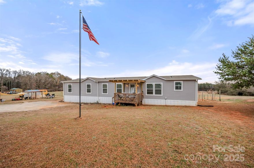 Enjoy space, privacy, and convenience in this expansive 4-bedroom, 2-bath home situated on over 1. Designed with a split floor plan, the private primary ensuite is thoughtfully separated from the additional bedrooms.The primary suite features a large walk-in closet and a spacious bathroom with double vanities, a soaking tub, and a generously sized walk-in shower. The additional bedrooms are well-sized and include walk-in closets for ample storage. A versatile den with a closet offers endless possibilities—perfect for a guest room, home office, or playroom—bringing the potential total to five bedrooms. The open-concept kitchen, dining, and living area is ideal for entertaining, highlighted by a large island and pantry. Step outside to a fenced backyard, perfect for pets, outdoor gatherings, or simply enjoying the peaceful surroundings.Seller may be willing to put on block foundation with an acceptable offer. Conveniently located near Hwy 221 and Hwy 221A, this home offers easy commuting while maintaining a sense of space and tranquility.