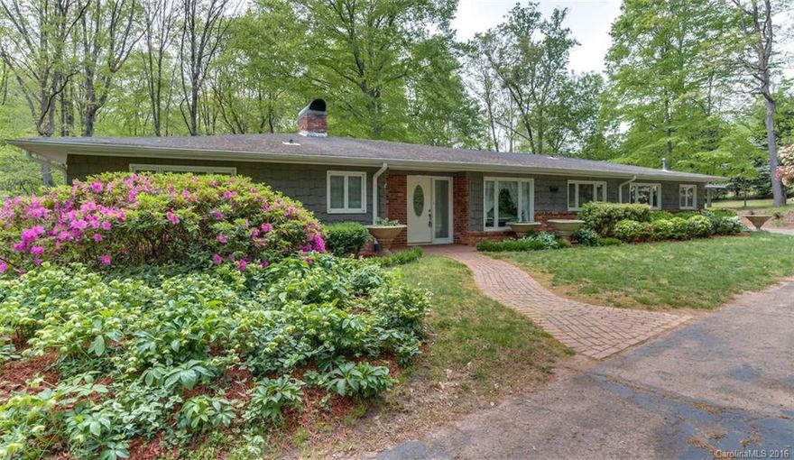 Custom 3 Bed, 2.5 Bath 1-level in one of Rutherfordton's Best neighborhoods! Nestled in the woods of Forest Hills w/ 1.82 acres. Interior features hardwood floors, spacious living & dining room w/ large Fireplace (can be gas or wood), Natural Gas Furnace & H2O, large kitchen w/ All Appliances staying, laundry room, large add'l Den/Family Room opening to pool area. Exterior features in-ground swimming pool, hot tub, 18x36 greenhouse w/ H2O, small creek, circular drive, invisible dog fence.