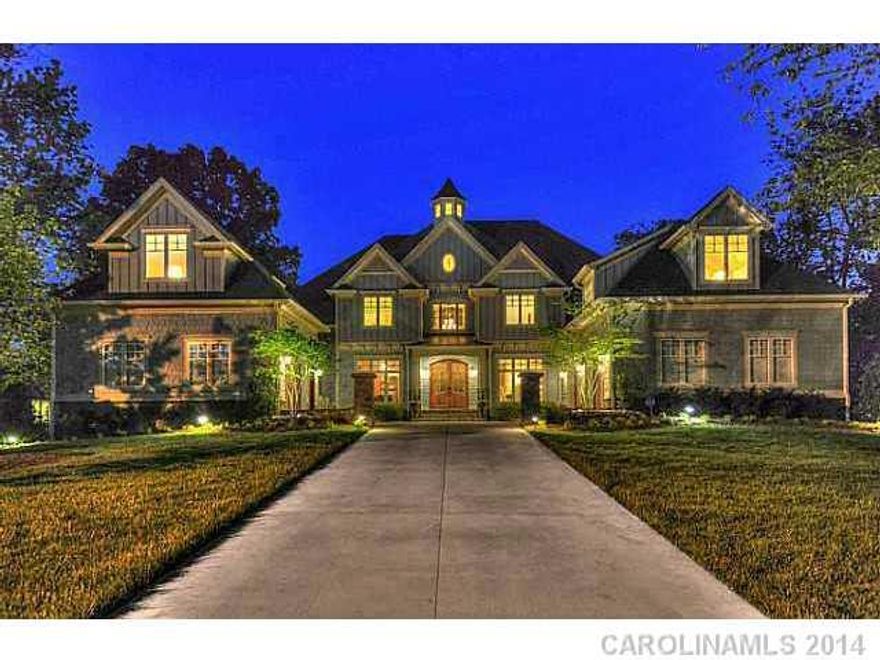 Beautiful coastal accents, with 3 floors of premium architectural features. Granite & custom stone throughout. Dramatic two story vaulted entrance extends to water side wall of windows. Fantastic stained wide plank hardwoods. Walkout lower level recreation and entertainment areas. Stone terrace with columns overlooking lake.