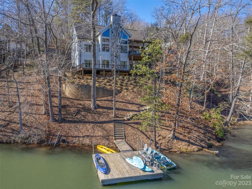 Stunning 2017 Arts & Crafts waterfront home on Bald Mountain Lake! Offered TURN KEY! 6 Bedroom/5.5 Bathroom with open floor plan-massive great room with floor to ceiling stone fireplace, large kitchen
island/breakfast bar, 2 Refrigerators, 2 Dishwashers, walk-in pantry. Primary bedroom the main
level with ensuite and walk-in closet. Spacious covered deck overlooking the lake perfect for
entertaining or grilling! Upper level features 3 bedrooms and 2 full bathrooms. Basement level
features a cozy den with game area, 2 additional bedrooms each with their own ensuite,
beverage bar, laundry room and even a garage for your golf cart! Low maintenance yard. Grab your oars and head down to the dock to enjoy the lake or take advantage of the amenities including 2 restaurants, 2 golf courses, outdoor and indoor pool, private beach, fitness center and so much home! This home is a successful vacation rental.