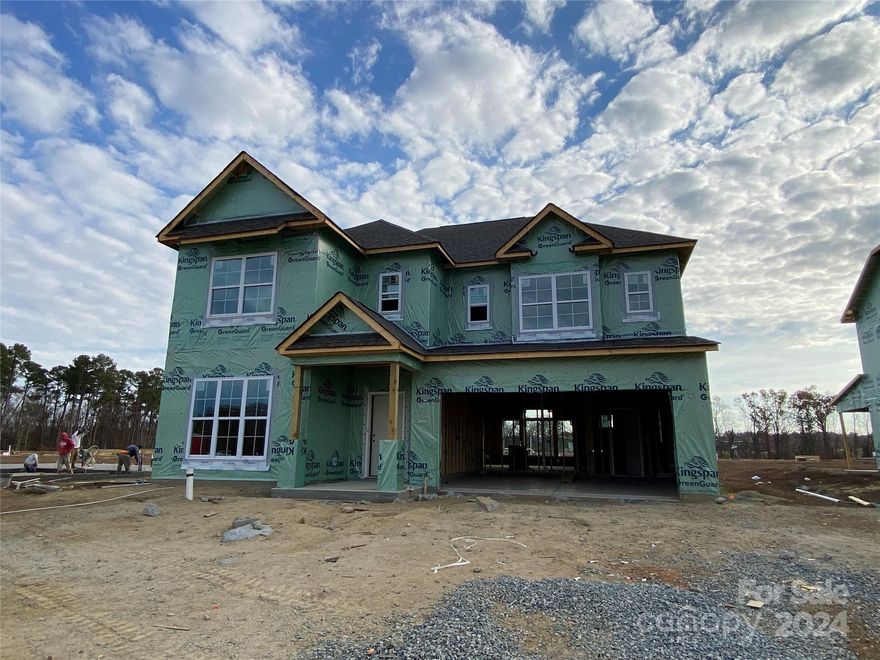Welcoming Craftsman-style home with painted siding & stone accents which faces north. Extensive has a built-in drop zone, space for a desk and large pantry. First-floor Flex rm w/ closet and full bath plus Rec Room upstairs. Kitchen w/ light Grey painted perimeter 42" cabs w/stained cabs at island, quartz counters, double trash pullout, GE Profile SS app w/ 36" gas cooktop, wall oven/microwave, SS chimney extraction hood vented outside, large SS undermount sink, brushed nickel lights. Family rm w/ vaulted ceiling & gas fireplace with marble surround. Sliding door leads to rear covered porch. Second-floor Premier Suite w/ tray clg; Bath has stained cabs, quartz counters, large tiled shower w/ semi-frameless glass & tiled floors. Secondary baths w/ quartz counters, tiled floors, steel tub with tiled surround, raised vanities. 6.5" hardwoods in most of 1st floor; tile in laundry. Oak treads on stairs. Future amenities: clubhouse, pool, tot lot, walking trails. Across from Stallings Park.