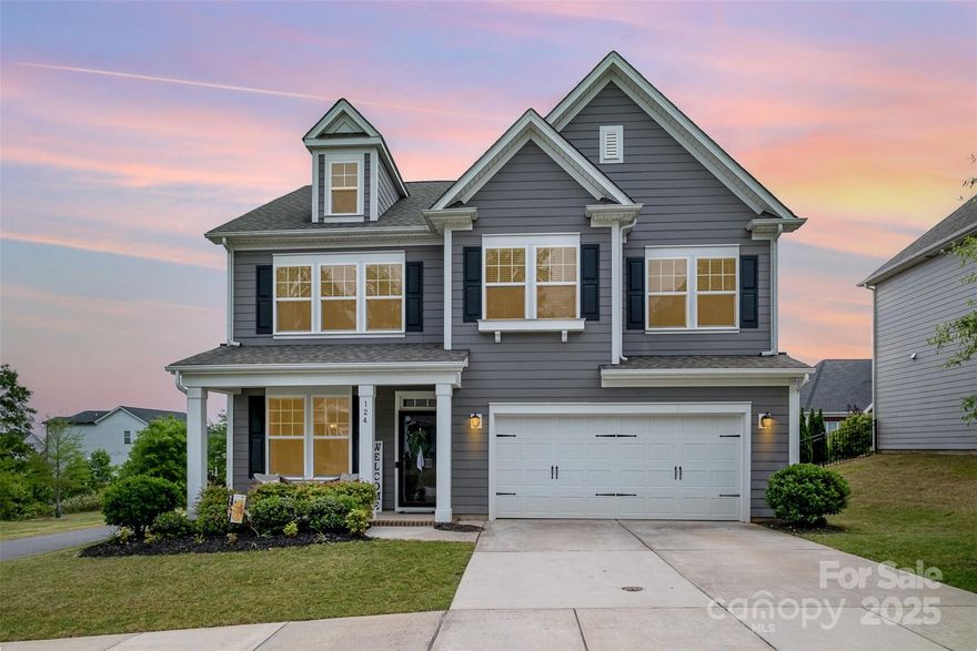 - Immaculate two-story home on a desirable corner lot
- Charming covered front porch and private fenced backyard with back patio  
- Modern luxury vinyl plank flooring throughout main living areas  
- Open-concept floorplan with abundant natural light  
- Gourmet kitchen featuring:  
  - Large island bar  
  - Granite countertops  
  - Stainless steel appliances 
  - Ample white cabinetry
  - Walk-in pantry  
- Spacious living area with stone fireplace as a focal point  
- 4 generously sized bedrooms upstairs, including a flexible bonus/game room
- Owner’s suite with:  
  - Cathedral ceilings  
  - Dual vanities
  - Enclosed glass shower  
  - Oversized walk-in closet
- Upstairs laundry room for added convenience  
- Close proximity to schools, shopping, dining, and commuter routes

Don’t miss your chance to own this stunning move-in-ready home—schedule your tour today!