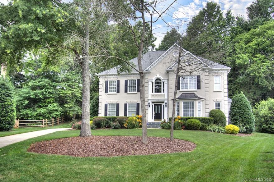 The soaring two-story foyer will welcome you into this traditional home on large cul-de-sac lot in convenient Providence Crossing. Warm wood floors throughout main living areas. Kitchen is lovely w/lots of new cabinetry, island, eat-at peninsula, granite & SS appls. Built-ins in FR. MBR is large w/tray ceiling & luxurious MBTH has his & hers sink areas w/granite, tile shower w/glass surround, & granite surrounded tub. Enjoy an afternoon on the two tier deck w/patio overlooking treed backyard.