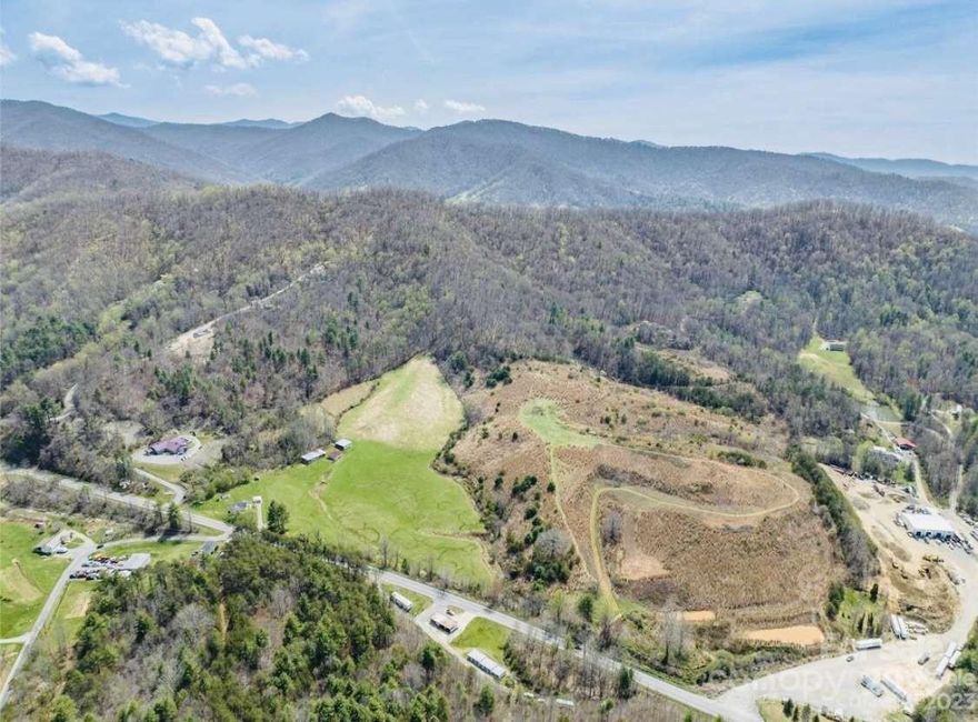 Nestled just less than 10-minute drive from Downtown Asheville, this exceptional 80 acres of land sits conveniently off exit 15 from I-26, boasting unparalleled interstate frontage. With over 50 acres of cleared land and breathtaking million-dollar views, it presents an ideal canvas for a myriad of ventures. Whether envisioning commercial multi-family complexes, heavy industrial distribution, hospitality establishments, retail centers, residential developments, wildlife preserves, or even a lavish and luxurious private estates, the possibilities are boundless. The flexibility to subdivide the land into any desired lots adds further appeal, while partnership and investment opportunities abound. Additionally, our esteemed builder and affiliated company stand ready in town to facilitate the design, construction, and sale of high end homes—be they spec, luxury, or bespoke estates—ensuring a profitable venture for discerning investors. Don't miss this opportunity!