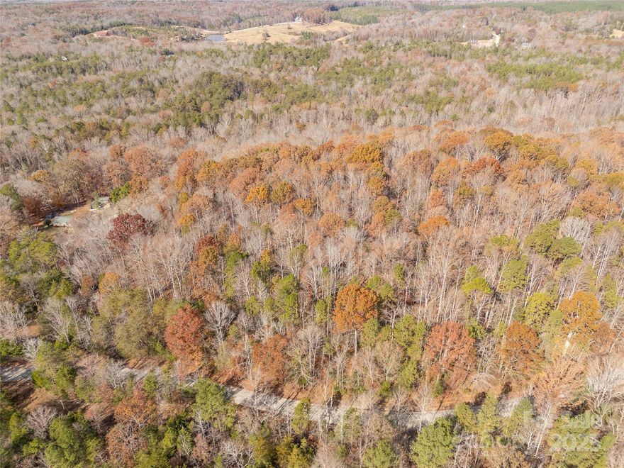 Discover 14.83 acres of quiet country living on Hillcrest Road in York, SC. Tucked away on a peaceful gravel road, this beautiful wooded tract offers a perfect blend of mature hardwoods and pines, creating a private and scenic setting for your future homesite. Multiple potential building spots provide flexibility for your ideal layout, whether you’re dreaming of a secluded retreat or a homestead with room to roam. A winding creek is at the back of the property, adding natural charm and enhancing the serene views throughout. Enjoy the sights and sounds of nature, abundant wildlife, and the unmatched tranquility of rural life—all while still being just a short drive from the conveniences of York and the surrounding area. If you’ve been looking for acreage that offers beauty, privacy, and endless possibilities, this is it. Build your dream home and embrace the peaceful countryside.