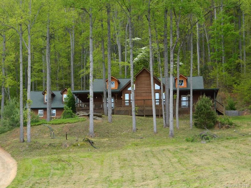 Private rustic retreat on 2 acres with year round views.  Wrap around deck for enjoying those summer nights.  Open plan with beautiful stone fireplace, large master suite and bath, walk in closets, oversized garage with workshop and 512 sf bonus room over garage not included in sf just needs heat and flooring. Great Mountain Retreat! No Sign.