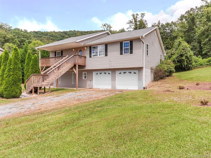 Mountain views from this fabulous home located in an East Asheville cul-de-sac.  3/2.5 home with bonus rooms and oversized garage on the lower level.  Large, gently sloping yard with swing set just waiting for a new family to enjoy.  Priced below recent appraisal.