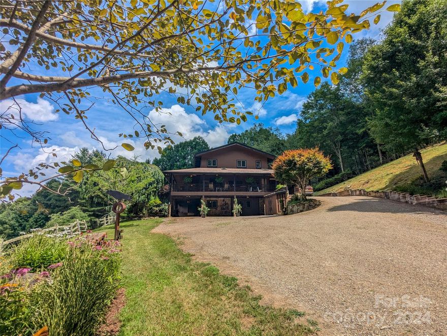 Nestled in a picturesque setting, behold 45.39 acres of pure bliss including a Magnificent 4BR/5BA Residence that is completely furnished, ready to move in and enjoy! Experience a lifestyle beyond compare w/this meticulously designed Post & Beam Home featuring open floor plan where every corner radiates warmth & charm.The private end-of-State-Road location ensures tranquility, offering serenity you deserve. Main level features open GR w/Chef's kitchen, massive native stone double wood burning F/P open to Sunroom w/skylights & lots of windows for enjoying Mother Nature in all seasons. Den, BR, BA and spacious utility/office,all on main level. Upstairs inludes 2 spacious Primary BRs w/large walk-in closets and full baths.  The lower level walk-out basement includes finished separate Guests Quarters w/LR/Kit/BR/BA + bonus room w/outside private entrance. Unwind in the embrace of breathtaking sunset views from covered porches, surrounded by nature's grandeur! This is your Sancturary!