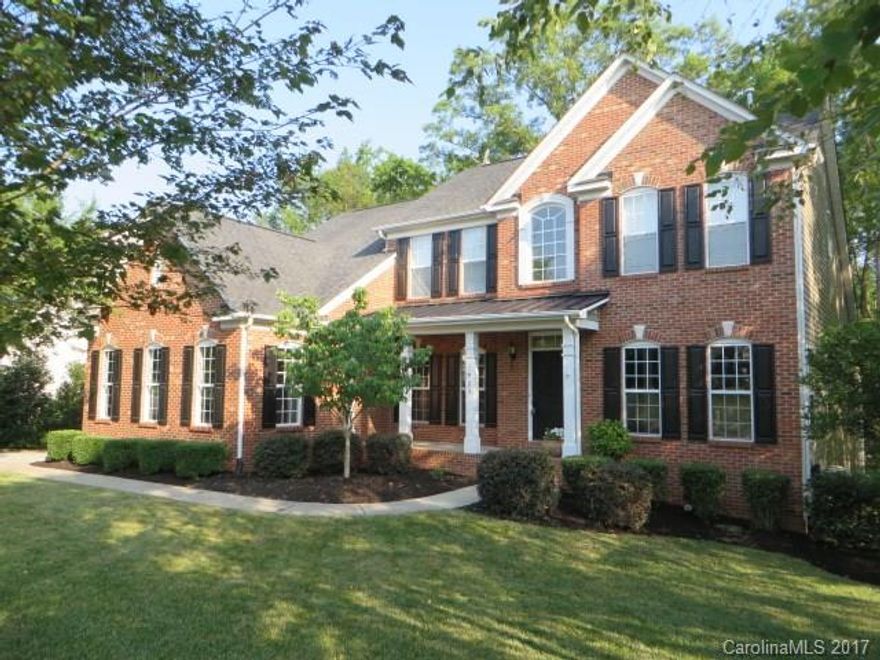 This brick front beauty offers an incredible amount of living space that incl a main level Master Suite & finished walk-out basement. Lots of fresh paint throughout. Gorgeous Kitchen w/double oven, gas cooktop, center island opens to vaulted Sun Rm w/ peaceful wooded views - no neighbors behind!. Formal DR. Office/LR w/french doors. 2 story Great Rm w/FP. Bright, open plan, gleaming HWs. Large workshop, Rec Room & Media Room on basement level. Front porch,deck & lower level patio. New Roof 2014.