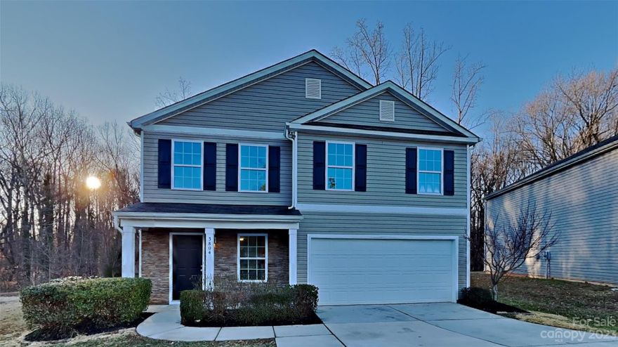 Welcome Home! This must see home off Statesville Road is conveniently located, minutes from I-77 access as well as shopping and dining options. Inside the home, step into your generous living area, open to the dining room which features lots of natural light. The kitchen has been updated to include bright cabinetry, as well as new granite countertops. Upstairs, you will find an oversized laundry room and full bath, two secondary bedrooms, both spacious and each with a walk-in closet. Also on this upper level, the incredible primary bedroom boasts vaulted ceilings, lots of windows, and an incredible closet with space for the most exquisite of wardrobes. Finalizing this amazing suite, is the attached private bath which features dual sinks, as well as a separate soaking tub and shower. Outside, the backyard is hardscaped with seating areas which overlook the wooded space behind. Stop by today, you'll love this one!