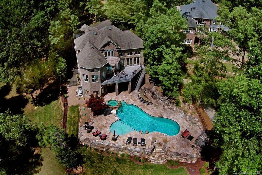 Pass through the gates to luxury, privacy, BIG water, amazing custom pool, outdoor pizza oven with 6723 SF of exquisite upgrades and flowing floor plan. The house lives like a 6 bedroom home despite the 4 bedroom septic report. The basement is finished with high end material like the main two levels with it's own garage, kitchen, covered porches and incredible outdoor space. The pictures and virtual walk through will speak for itself as this home is priced aggressively so come preview ASAP!!!