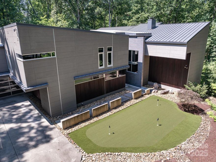 The epitome of luxury and modern living, meticulously crafted by Peadon Finein harmonizing contemporary design w serene tranquility. This architectural gem offers an oasis of peace and elegance, highlighted by abundance of light-filled spaces. Family room boasts impressive floor-to-ceiling windows, a seamless connection to the stunning natural landscape. Exquisite pool and spa, complemented by IPE decking and outdoor movie screen. Reclaimed redwood accents on walls/ceilings, adding warmth and character. Sleek gourmet kitchen a culinary haven w spacious island, quartz countertops, custom cabinetry, Sub Zero appliances. Striking 125-gallon floor aquarium. Owner’s suite w two generous walk-in closets, luxurious bathroom w soaking tub, zero-entry shower, private balcony adorned w new turf (2025). Four additional secondary bedrooms w ensuite baths. Dedicated craft room, theater room, exercise room, and wine cellar for approx 300 bottles. Enjoy your outdoor putting green, spacious garage!