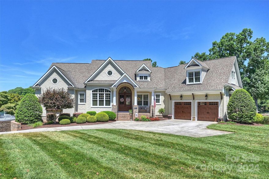 Look no further, perfection on the lake!  Beautiful custom built waterfront home that offers all of the special features of lake living.  Main level provides a very open and bright setting - gourmet kitchen, large island with tons of extra space, great room with stone fireplace and vaulted ceilings. Luxurious Primary bedroom with spacious bath and closet. Ample windows to offer amazing views of Lake Norman. Office on upper level. Lower level/basement has a special custom built bar, kitchen, entertainment area, 2 additional bedrooms with en suite bathrooms. Step out to a wonderful outdoor living area with built in gas grill & ceramic smoker/grill, outdoor gas fire pit, plenty of sitting areas for enjoyment.  Covered floating dock with low maintenance decking, boat lift & personal watercraft lifts. Approximately 160’ ft of shoreline with rip-rap.  Lake fed irrigation and landscape lighting.  2 car garage on the main level with an additional oversized 2 car garage/shop on the lower level.