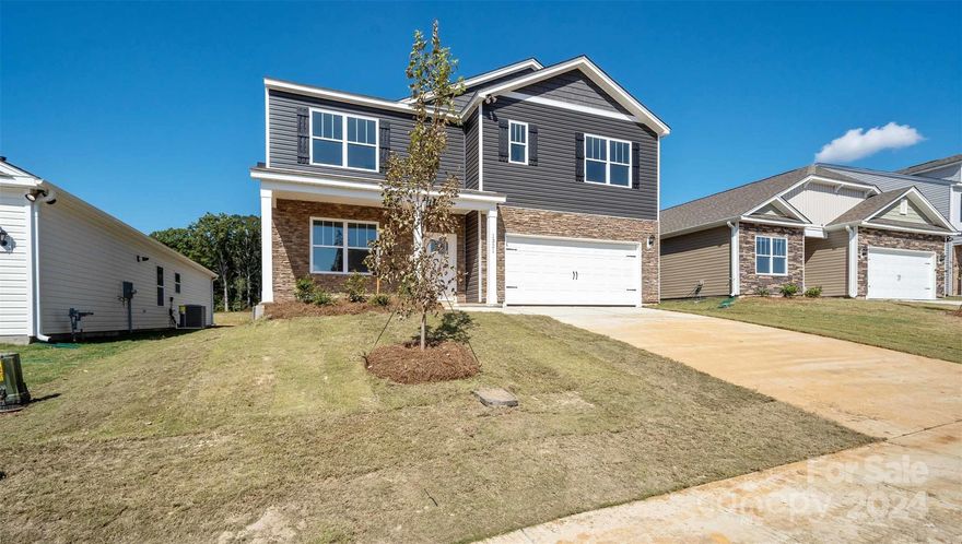 Secrest Commons is conveniently located off of Hwy 74-Independence Blvd and ML King Jr. Blvd.  This home is an incredible value with all the benefits of new construction and a 10 yr. Home Warranty! Home is Connected package includes programmable thermostat, Z-Wave door lock and wireless switch, touchscreen control device, automation platform, video doorbell, and Amazon Echo Dot.  The Hayden plan features a main level office, Main level guest bedroom and bath, plus four spacious bedrooms and loft upstairs. This open floor plan concept is great for entertaining, and the kitchen features a granite countertop and ceramic tile backsplash. There is no shortage of storage space all throughout the home. All home features are subject to change without notice. Please ask agent for details!