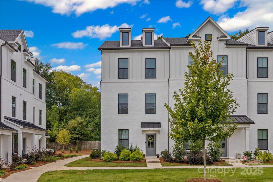 Better than new—this Cotswold town home has it all! 4-bedroom end-unit with sleek white brick exterior, modern black accents, and designer finishes throughout. The open layout is perfect for entertaining featuring a stunning chef’s kitchen with large island, stainless appliances, 5-burner cook top, wall oven, designer cabinetry, tile backsplash, and pantry too. Oversized sliding doors fill the space with light and open onto the balcony. You’ll enjoy a spa-inspired primary suite with large, tiled shower with bench, dual sinks and huge walk-in closet. 2 more bedrooms on the upper level and laundry for convenience. The main level entry has the 4th bedroom suite great for guests, a roommate or a secluded workspace—you choose. Minutes from Charlotte’s top hot spots—Uptown, SouthPark and all the shopping, dining, and entertainment these areas have to offer. It's fresh, stylish, and ready for you to call home!