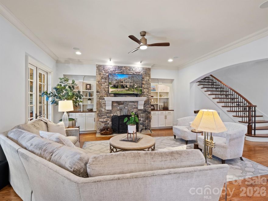 Welcome to this masterfully designed Frank Smith home that blends timeless architecture with exceptional modern luxury. Thoughtfully crafted for both elegant entertaining and everyday comfort, this residence showcases refined finishes, impeccable attention to detail, and versatile living spaces throughout.
At the heart of the home is a gourmet kitchen, designed for the serious cook, complemented by a fully equipped scullery —perfect for hosting, catering, or seamless organization. Showcase your collection in the impressive 900 bottle, climate controlled wine room! The adjacent great room offers an inviting gathering space filled with natural light and effortless flow. The main-level primary suite is a private retreat, featuring a spa-like bath with heated tile floors, luxurious fixtures, and a calming, resort-style ambiance. Additional main-level conveniences include a beautifully appointed study, a laundry room with custom cabinetry, and a thoughtfully designed kids’ study/craft room. Entertain with ease in the media room, stay active in the exercise room. A whole-house generator provides peace of mind year-round. The detached garage includes a finished room above, ideal for guest quarters, a private office, or second living space. Outdoors, the professionally landscaped yard creates a serene setting for relaxation and entertaining, completing this exceptional property. 229 Wrenwood Lane offers a rare combination of architectural pedigree, luxury amenities, and functional design—an extraordinary place to call home.