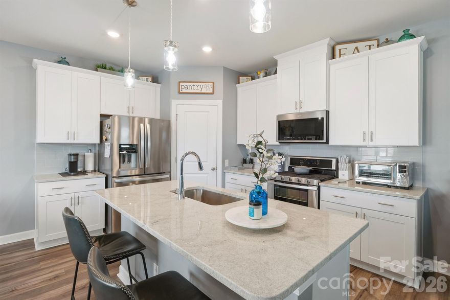 Welcome home to this beautifully maintained, energy-efficient 2021 Meritage Homes residence in the sought-after Larkhaven Hills community! This move-in-ready two-story home offers 3 bedrooms, 2.5 bathrooms, and 1,887 sq ft of open-concept living on a quiet cul-de-sac with one of the neighborhood’s longest driveways—easily fitting 4+ cars.

Inside, the bright, open main level is perfect for everyday living and entertaining. The gourmet kitchen features white/gray granite countertops, a large island, a walk-in pantry, and modern finishes. Upstairs, you’ll find a spacious primary suite with dual sinks, a walk-in shower, and generous closet space, plus two additional bedrooms, a full bath, and a versatile loft ideal for a home office, play area, or bonus space.

Modern touches include durable EVP flooring, plush multi-tone carpet, and thoughtful upgrades throughout. The 2-car garage offers built-in overhead storage, and the low-maintenance newer construction means more time to enjoy life. Added peace of mind comes with the HomeTeam Pest Defense in-wall system (exterior treatment injected directly into the walls) and a transferable termite bond.

Residents love the community amenities—clubhouse, outdoor pool, playground, sidewalks, street lights, and walking trails. Turn-key opportunity: Most furnishings and appliances (refrigerator, washer, dryer) are available for purchase, making this a truly move-in-ready home. Conveniently located on the edge of Mint Hill with quick I-485 access, you’re minutes from downtown Mint Hill, Charlotte shopping/dining, parks, and major employers.

This home offers comfort, convenience, and value in a family-friendly neighborhood. Don’t miss your opportunity—schedule a private showing today!
