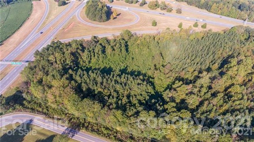 This land is highly visible from I-85. Lies between Mountain View Road and I-85. Completely wooded and located 6 miles East of site of New Casino in Kings Mountain. Currently Zoned Industrial. Over 2100 ft. of road frontage on Mountain View Road.