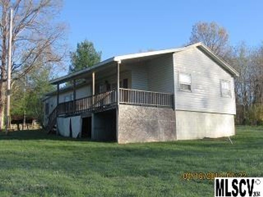 2 bed bungalow on over 1 acre, has oil monitor heater for heat, some repairs but overall could be moved into, nice semi private setting.