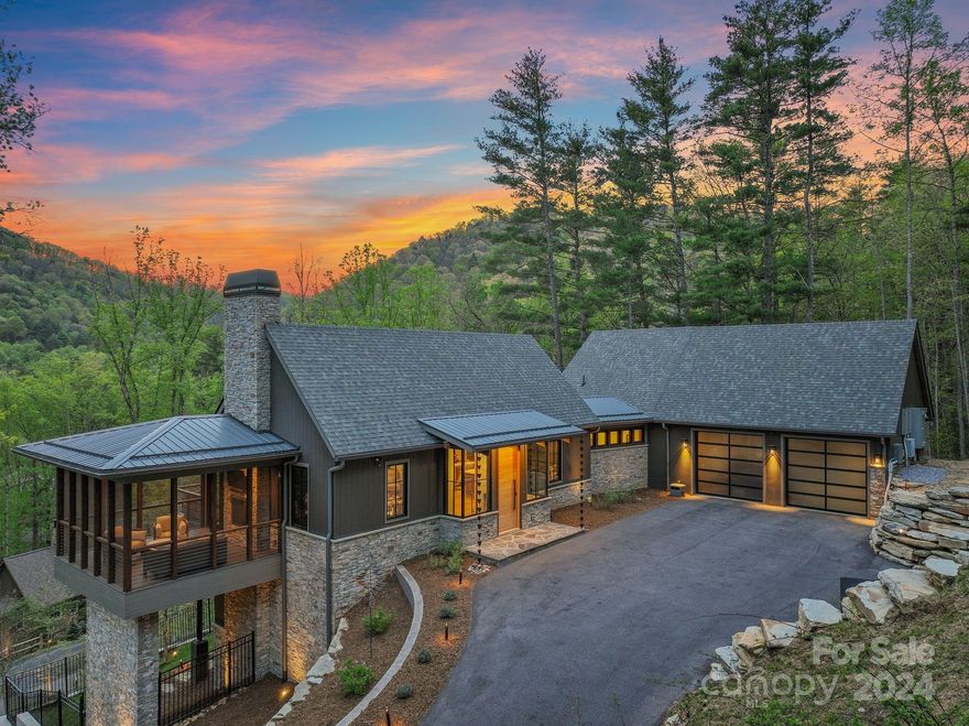 Designed by Samsel/Altura Architects, built by Sulaski & Co, this home exemplifies contemporary elegance & modern functionality. The living room is gracious & inviting, with an eye-catching double-sided fireplace, lofty ceilings & a convenient wet bar for entertaining. Just off the living room & sharing the fireplace is a screened-in porch. Glass doors open to an uncovered porch. The open-plan kitchen is equipped with stainless steel appliances, stylish cabinetry & large windows. The main-level primary suite is a peaceful retreat, complete with a luxurious bathroom featuring a soaking tub & tiled shower. Downstairs, you'll find three generously sized bedrooms, two beautiful bathrooms, and a flex space with wet bar. Take a stroll off the lower level patio through the recently landscaped & hardscaped lawn down to the fire pit area (wired for electricity). This home is crafted to seamlessly marry aesthetics with functionality. Heated driveway and generator complete the package.