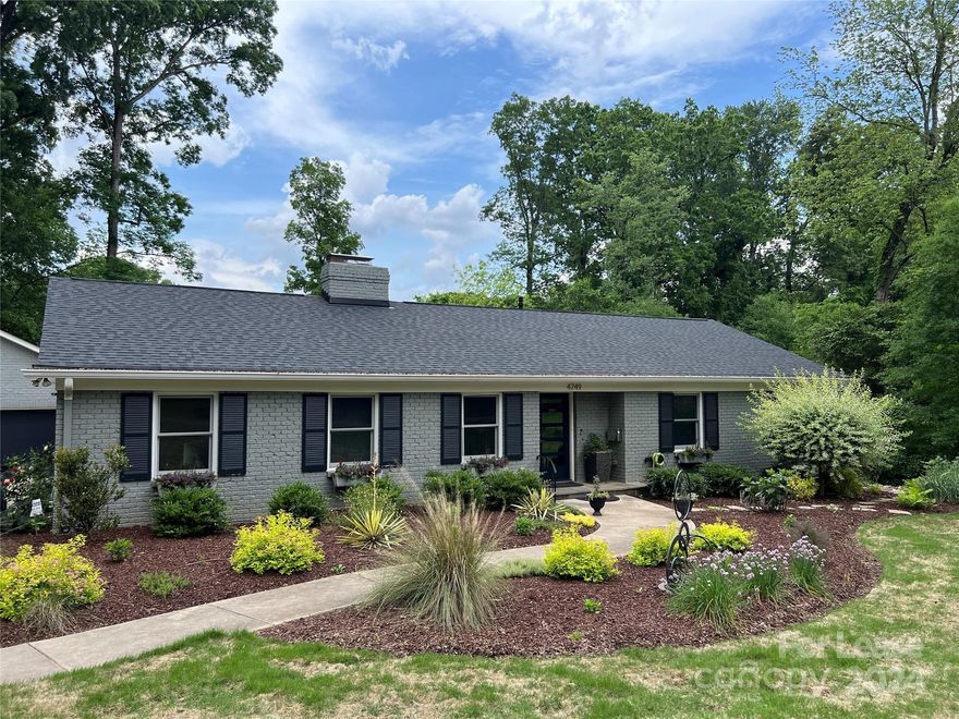 LUXURIOUS COTSWOLD RETREAT - Remodeled ranch with Huge Garage in Myers Park High district. Walking distance to Cotswold village and Publix, yet tucked away on quiet Gaynor Rd, this completely updated home will feel like a retreat in the heart of Charlotte. The thoughtfully designed modern kitchen includes abundant counter space and state of the art Wolf appliances. The kitchen flows into two spacious living areas. One acnhored by a gas fireplace and vaulted ceilings, while the other features custom uplighting and a view of the back deck. You'll love your own private primary suite with heated floors, heated towel rack, dual shower heads, dual vanities, and dual closets! You'll also love the designated office space over looking the front yard, two laundry rooms, and outdoor living area with surround sound and HOT TUB! Don't miss possibly the best feature: the oversized two car garage with room for storage, workshop, or home gym. Enjoy low maintenance life as lawn care is included!