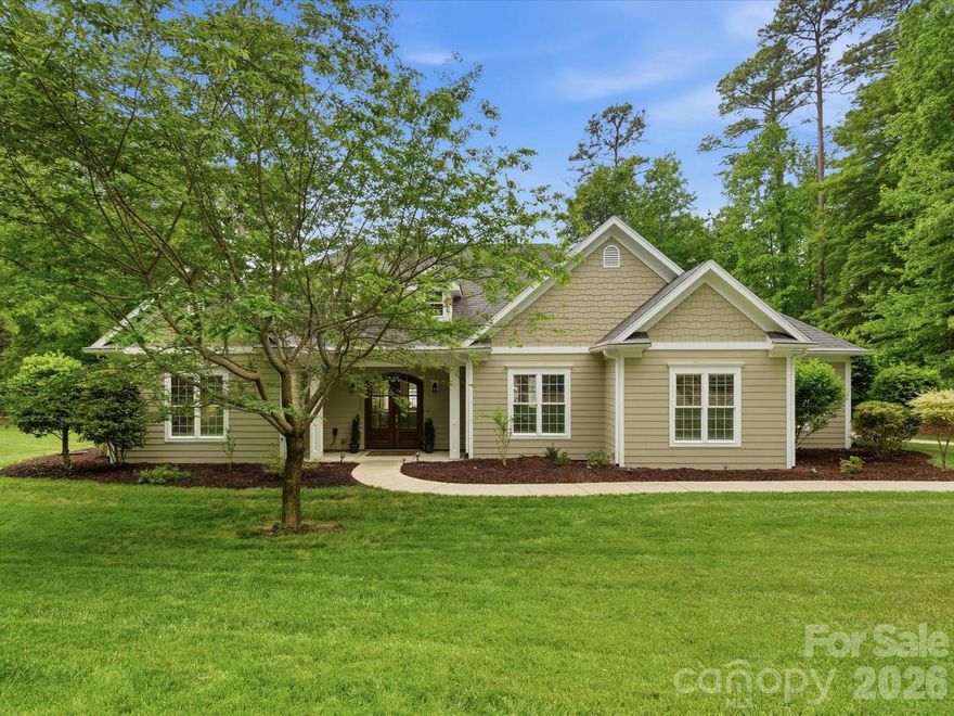 Lake Norman home with deeded boat slip on the sought-after Brawley Peninsula! This beautifully updated 4BR home sits on a private .95-acre lot with lake views and an in ground-salt water pool, offering the ideal blend of comfort and lifestyle. The open floor plan features all bedrooms on the main level plus a dedicated office with custom built-ins. The kitchen with new quartz countertops, backsplash and gourmet appliances (THOR & Bosch), flows into the great room overlooking the pool & covered veranda perfect for entertaining. Beautiful custom trim throughout. The primary suite includes dual walk-in closets, soaking tub, dual vanities, and a separate tile shower. Three secondary bedrooms share two full baths. Upstairs offers a massive bonus room and additional flex space for a media room, gym, or guests. Recent updates include new: LVP flooring, exterior paint,  fence, shed, and quartz counters in bathrooms, along with noted kitchen updates. Oversized 3-car garage with workshop space, half bath, pool access, and separate staircase to bonus room. There is a LARGE unfinished storage so you will never need to climb attic stairs again! The deeded boat slip on Fawn Lane includes parking and picnic area, just a short golf cart ride away. Enjoy tranquil lake living while being conveniently located to The Pointe for golf and dining/shopping within minutes.