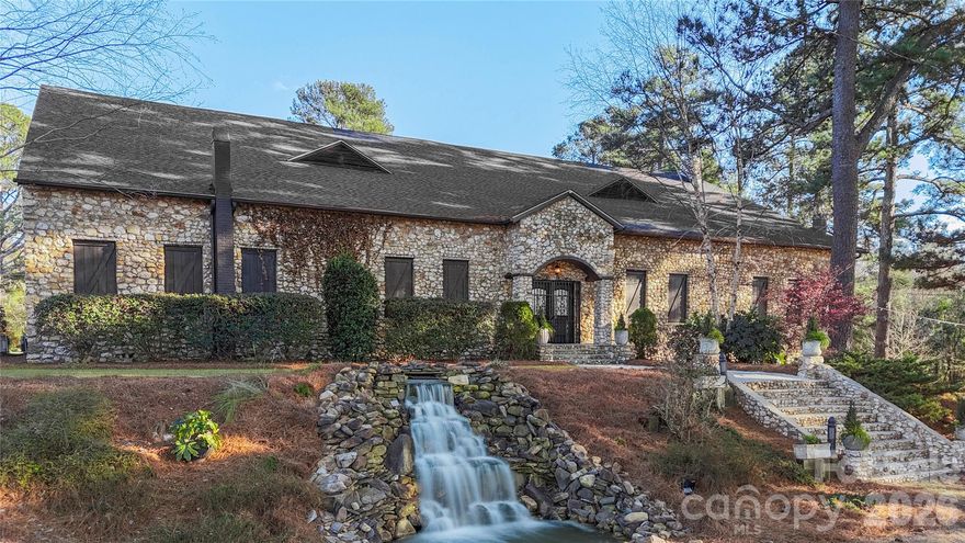 Step into the timeless allure of Olde Stone Villa, a masterpiece of historic craftsmanship nestled in the heart of Mount Croghan, SC. Originally constructed in the 1800s from locally sourced fieldstone, this extraordinary estate and coveted wedding venue has been meticulously restored to balance its storied past with modern elegance.

Set on 2.78 acres of lush, landscaped grounds with cascading waterfalls and serene open-air ceremony spaces, the property promises an enchanting backdrop for unforgettable moments. Spanning over 9,700 square feet, the villa features soaring 22-foot ceilings, 22-inch-thick stone walls, and original hardwood floors that exude character and sophistication. The grand hall, with space for up to 400 guests, is complemented by a distinctive tin roof bar and a charming balcony offering picturesque views. A brand-new roof (installed 11/2023) ensures lasting durability.

Olde Stone Villa’s sale includes everything you need to seamlessly continue its legacy as a premier venue: tables, chairs, linens, lighting, and even décor items, all thoughtfully curated to enhance its timeless charm. This turn-key offering ensures the transition is as effortless as it is inspiring.

Whether you envision hosting weddings, galas, or exclusive events, Olde Stone Villa is a rare opportunity to own a fully operational venue that seamlessly blends luxury with legacy. This is more than a property, it’s a chance to invest in history, beauty, and boundless potential.