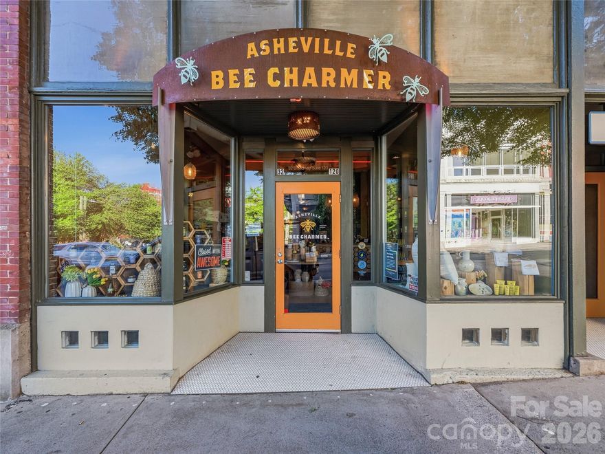 This one checks all the boxes. Positioned on one of downtown Asheville’s busiest retail streets in the historic Jenkins Building, this retail/office condo has great visibility, natural light, a thoughtful, flexible layout, high quality finishes, and parking.  Generous storage (1,234 SF storage room on lower level) and two dedicated interior parking spaces (accessed via a roll-up garage door from the rear alley) make this condo a practical choice for an array of businesses. This premier location benefits from consistent pedestrian traffic and year-round tourism, benefiting from hospitality neighbors including The Windsor Boutique Hotel, Kimpton Hotel Arras, and AC Hotel Asheville Downtown.  Space available for owner occupant or new tenant from January 6, 2027.