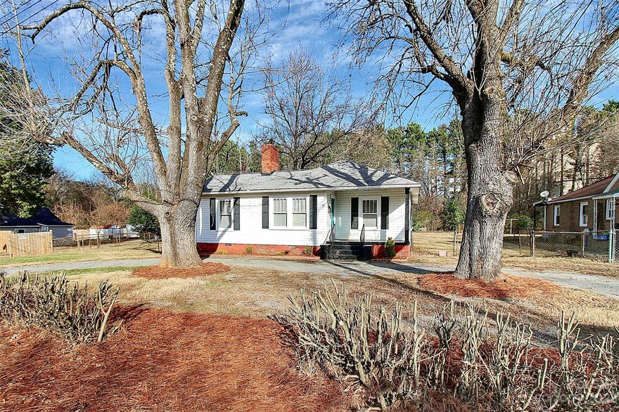 Welcome home to 828 Wabash Ave. This picturesque 3 bed 1 bath in Northwest Charlotte has just been given new life and is ready for you to move in. Coming down the quiet street, you encounter a large, U-shaped driveway which provides ample parking for any gathering. Entering the home, you're greeted by an inviting semi-open floor plan, with a beautifully remodeled sealed fireplace, which now functions as a mantle and timeless centerpiece. Each bedroom is very spacious and allows for plenty of natural light to flood in. Fresh paint and LVP flooring throughout provides each room with a breath of fresh air. The kitchen has also been given new paint, solid-surface countertops, and a new SS electric range. Enclosed rear mud room provides an area to remove shoes before entering. A large front and backyard provide plenty of space for pets and entertaining during the warmer months Your new home or investment property awaits; book your showing today.