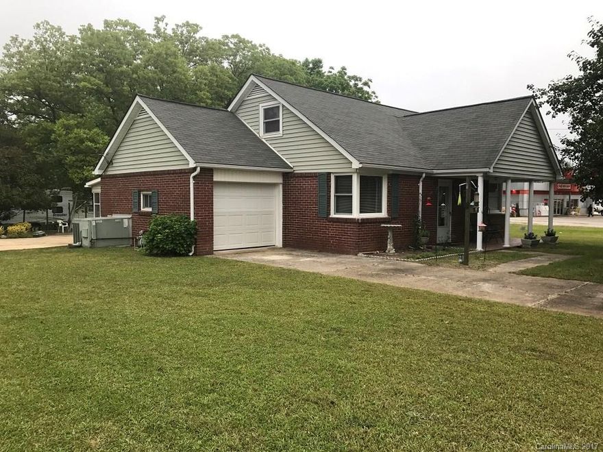 Don't judge a book by its cover! The second story under the roof features 2 bedrooms and a bathroom. Multi- use is available since this property is zoned for general business. Formal dining, lots of indoor storage, 1 car garage, screened porch on the rear with a carport. This oversized master suite has room for a sitting area and a separate shower and tub in the master bath.  Schedule an appointment today for this NO MONEY down PROPortunity!!!