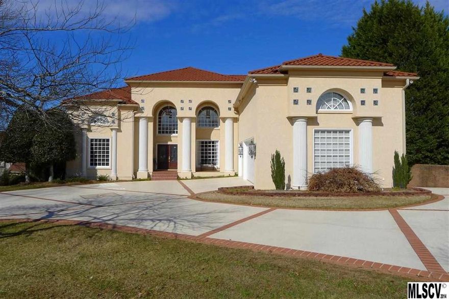 This magnificent Mediterranean-style home in Moore's Ferry will make you feel like you are on vacation year-round! Enjoy panoramic views of Lake Hickory from all three levels, and soak in the sun from your deluxe in-ground pool, terrace with fireplace, or waterfront party deck and covered dock. The stunning interior offers soaring ceilings, walls of windows, & the finest quality amenities you can find. The great room features floor-to-ceiling bookcases with ladder, wet bar, formal dining area, and exits onto the rear terrace. The open kitchen features tons of bar seating, professional appliances, & keeping room with fireplace. Unwind in the main-level master suite with two fireplaces & marble lined bathroom with jetted tub, steam shower, bidet, & his/hers vanities. The winding staircase leads to three additional bedrooms, each with private bath, & a charming home office. Full lower level with rec room, 2nd kitchen, bedroom suite, & indoor basketball court.