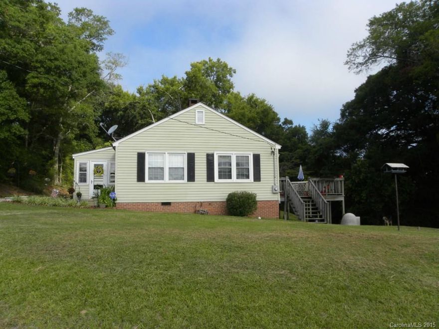 You will love this home! It is move-in ready and in pristine condition. Every detail has been taken care of. New windows. New plumbing. New flooring. Roof only a few years old. 24x32 wired shop with 2 roll-up doors. Large lot. Wood burning fireplace. Home qualifies for 100% financing. Own for less than rent. Call now.