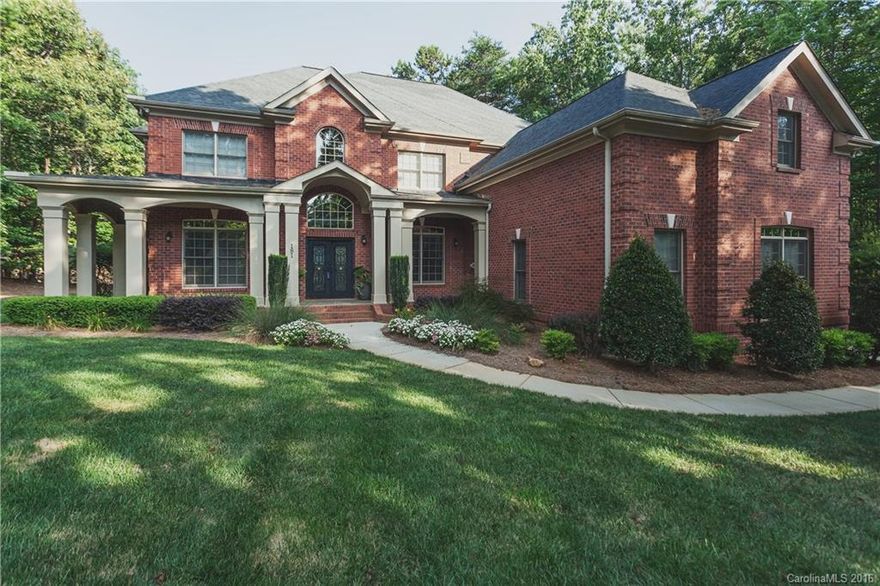 You must see this all brick gem located on a heavily wooded lot which gives a private feel.  The open flow makes this plan ideal for entertaining.  Nothing to do but move in, too many custom features to list.  Make this your new home all while enjoying the rich amenities of The Farms.