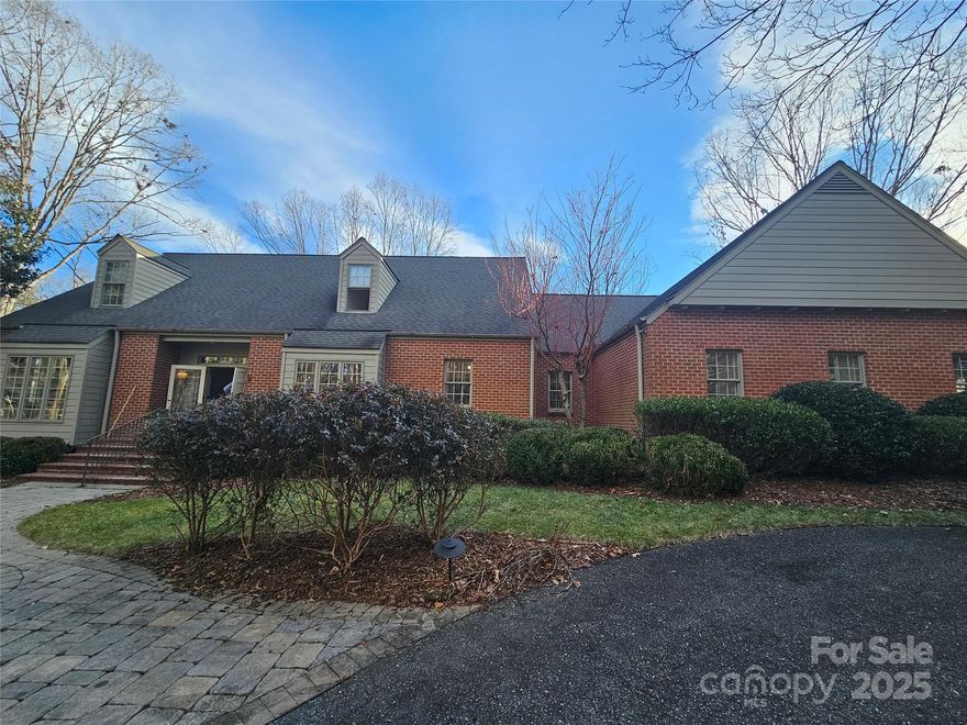 This spectacular 1.5 story custom-built, one-owner brick home with a large, mostly finished basement and two attached garages overlooks recreational Moss Lake.  Wander down to the waterfront and stop to enjoy the gazebo and mature landscaping on over 2.5 acres of land.  The covered two-slip boat dock with an upper deck makes for the perfect location to entertain guests or enjoy the sandy beach with friends.  Enter the more than 6,000 sq ft home and you'll find hardwood floors throughout most of the main level, large picturesque windows, ornate light fixtures, and towering ceilings.  Enjoy the fireplace and a good book from one of the many built-ins in the family room or appreciate the views from the sunroom.  On those cold nights warm up in the primary bedroom by the fireplace or step out onto the deck to catch a breeze on summer nights.  The primary bedroom features an ensuite bathroom with side by side sinks, a shower and a garden tub. Circular driveway for added convenience.