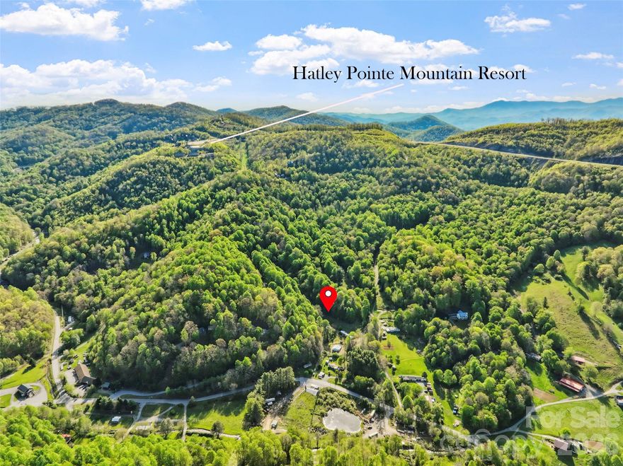 Investor special located just minutes from Hatley Pointe Ski Resort, offering a rare opportunity to own unrestricted land in a desirable mountain setting. This property is ideal for investors, builders, or buyers seeking flexible use with strong potential for development, rental income, or a private homestead.

The property is equipped with two installed septic systems, providing the possibility for multiple homesites or multi-generational living. A natural spring adds to the property's value and usability, while electric is available for hookup, helping streamline the building process. Established fruit trees enhance the landscape and offer a charming, functional addition to the land.

With no restrictions, the possibilities are truly endless—build your primary residence, create a family compound, develop multiple rental units, or establish a mountain retreat. The layout and existing infrastructure make it well-suited for those looking to maximize the property's potential.

Conveniently located near outdoor recreation, including skiing, hiking, and mountain activities, while still offering privacy and space. Easy access to Mars Hill and surrounding areas provides a balance of seclusion and convenience.