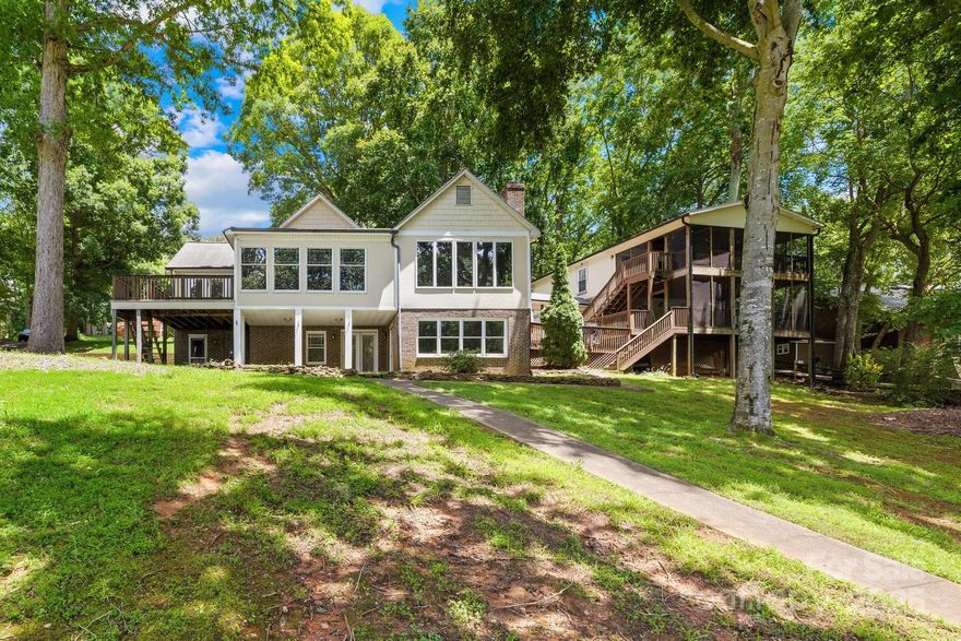 Welcome to 698 Normandy Road! Nestled on a spacious lot in a peaceful cove that opens to big water & no HOA! This 3-bedroom, 3-bath home with a ton of potential offers breathtaking views and an inviting open-concept design ideal for everyday living & entertaining. The main level features a primary bedroom with an en-suite bath, a secondary bedroom, and full bathroom. Natural light fills the space, creating a bright and welcoming atmosphere throughout. Step outside to your own private oasis—complete with an oversized deck, a large backyard perfect for pets and play, boat ramp, and a large, grandfathered dock! House needs TLC/updating. A detached guesthouse offers additional space for visitors or the perfect opportunity for short-term rental income (STR). The walkout basement adds even more space for entertaining & guests. With multiple garage spaces, there’s plenty of room for vehicles, storage, and lake toys. Don't miss your chance to own this exceptional lakefront property.