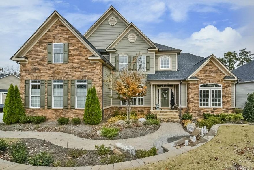 Grandeur & Elegance Flows Throughout this Stone Accented Home with Finished Lower and 2 Screened Porches!  2 Story Great Room with coffered ceiling & wall of windows. Expansive Chef’s Kitchen with lg granite work island, expansive custom cabinetry & SS GE Profile appliances. Sunlit Brkfst Area.  Master on main plus Sitting Area with fireplace. Lower Level Rec Rm with fireplace, dining area, & utility/workrm. Stunning: columns, millwork, ceilings, hardwoods! Perfectly located by  I-77 & shopping!