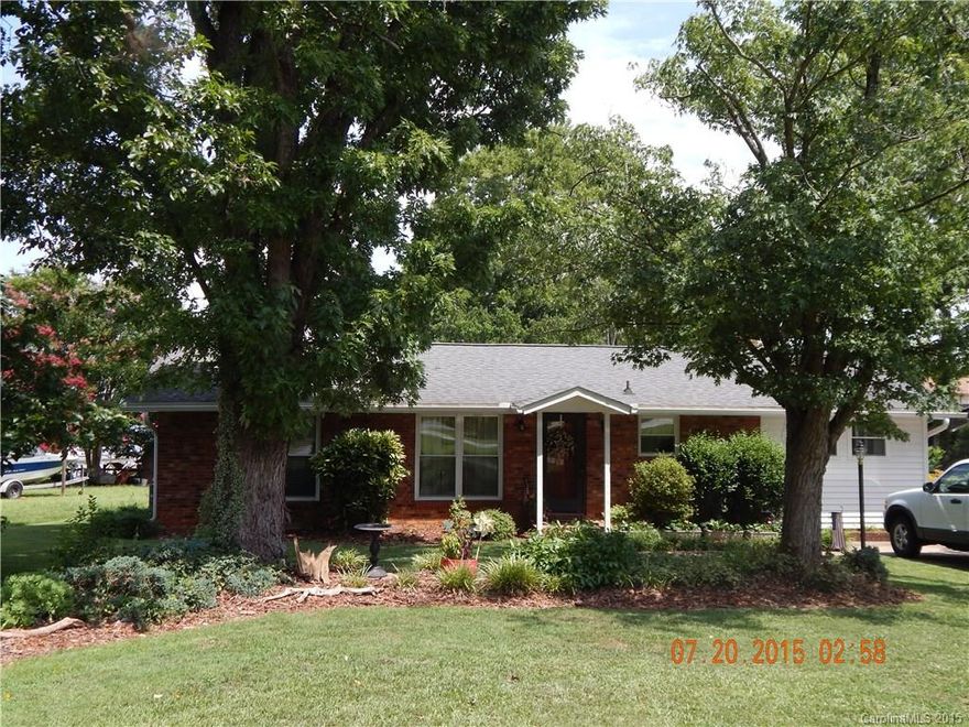 Gorgeous large water front lot with boat dock.  Seperate single garage/storage bldg w/attached carport for storing a boat.  Screened in porch on back looks out to lake. Very charming, warm and inviting home w/wood flooring open kitchen with island and pass through window.  Special financing incentives available on this property fromSirva's preferred lender. 253 additional sq. ft is the addition and is heated.