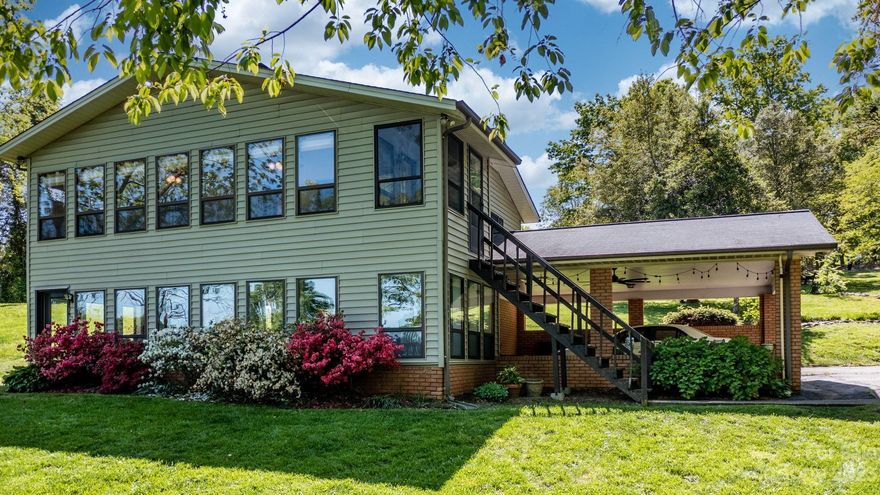 Watch the sun rise over the lake - main channel views without the high traffic! Perfect year-round lake house to play on the water or cozy up by the wood-burning stove. Lovingly remodeled top to bottom, including updates such as water heater, kitchen, floor coverings (Mannington Adura LVP, Shaw carpet + premium pad), interior paint, garage roof (2020), well pump (2019) and main water line replacement (2021), new decking on dock (2016), custom top-down, bottom-up wooden shades upstairs (2021), HVAC (2105). Three lots offer over 1 and 1/2 acres, wooded views and privacy. 145 feet of shoreline with no maintenance rip-rap and no seawall. Covered 20' boat slip and dock with swim ladder, room to relax in the sun or shade. Beach area to launch a paddle board or enjoy a lakeside bonfire. Plentiful storage in the two-car, detached garage, plus attached carport for parking or relaxing.